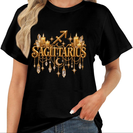 A woman wearing a black short-sleeve t-shirt with a gold Sagittarius zodiac graphic on the chest, paired with blue jeans against a plain white background.