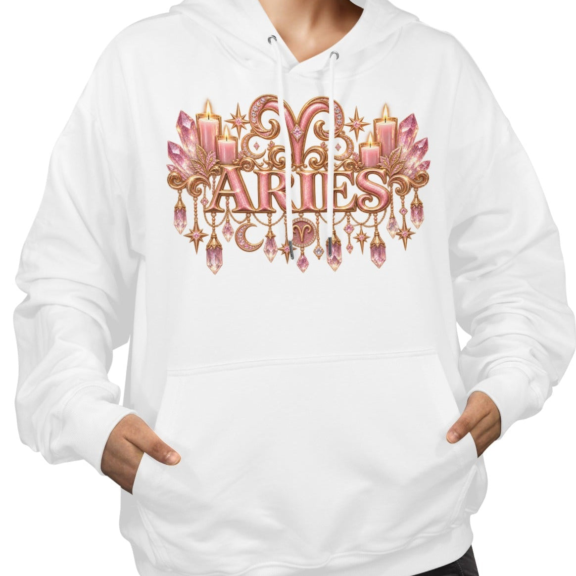 A woman wearing a white pullover hoodie with a large decorative chest graphic that reads 'The Vixen Barbie' in pink and gold tones, paired with black pants, against a plain white background.