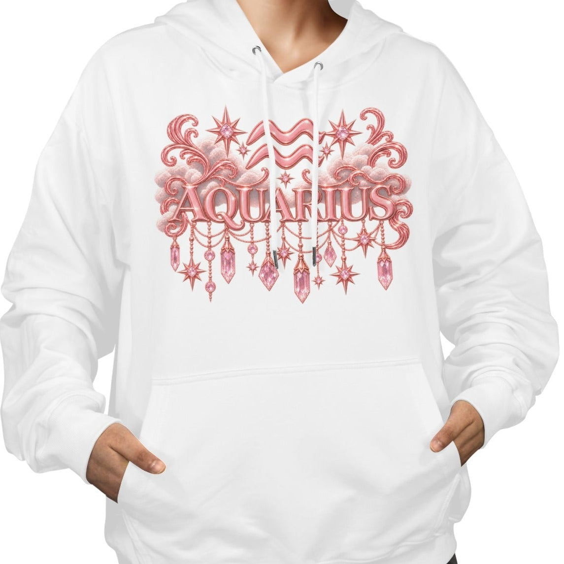 A woman wearing a white pullover hoodie with a pink 'AQUARIUS' zodiac-themed graphic on the chest, paired with black pants, against a plain white background.