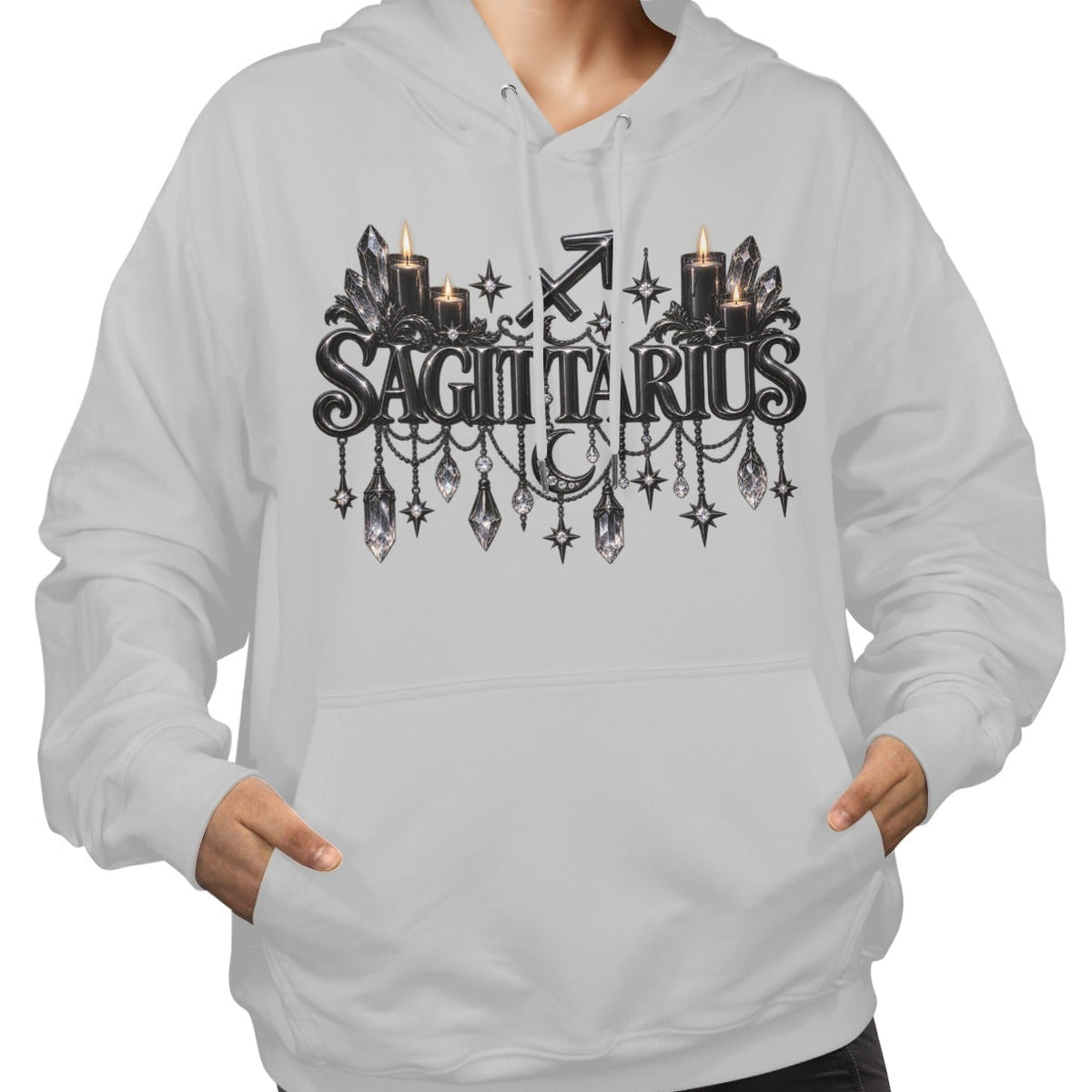 A woman wearing a light gray pullover hoodie with a black gothic 'SAGITTARIUS' graphic featuring candles, crystals, and a zodiac symbol on the chest, set against a plain white background.