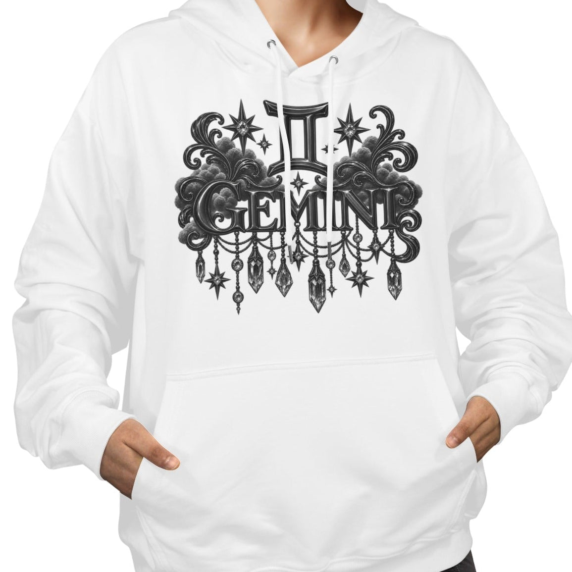 A woman wearing a white pullover hoodie with a black ornate Gemini zodiac graphic on the chest, paired with black pants, against a plain white background.
