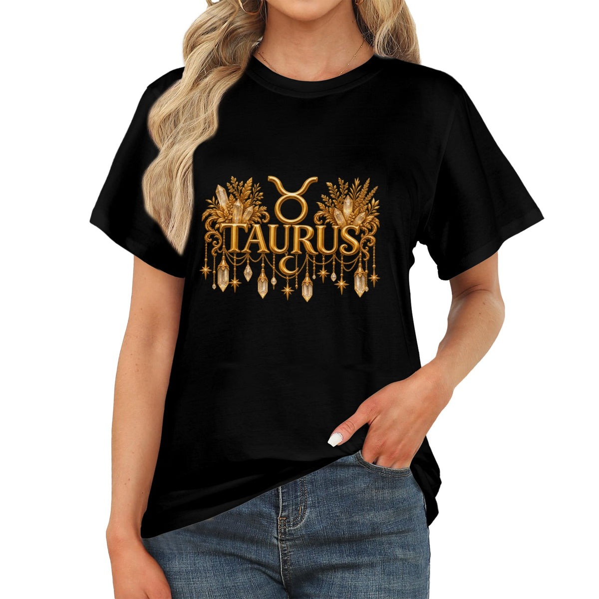 A woman wearing a black short-sleeve T-shirt with a gold Taurus zodiac graphic on the chest, paired with blue jeans against a plain white background.