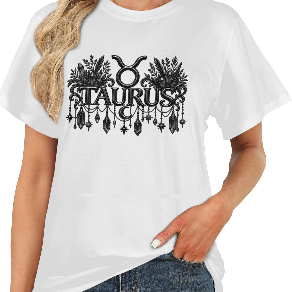 A woman wearing a white short-sleeve t-shirt with a black graphic of the Taurus zodiac sign and symbol, paired with blue jeans against a plain white background.