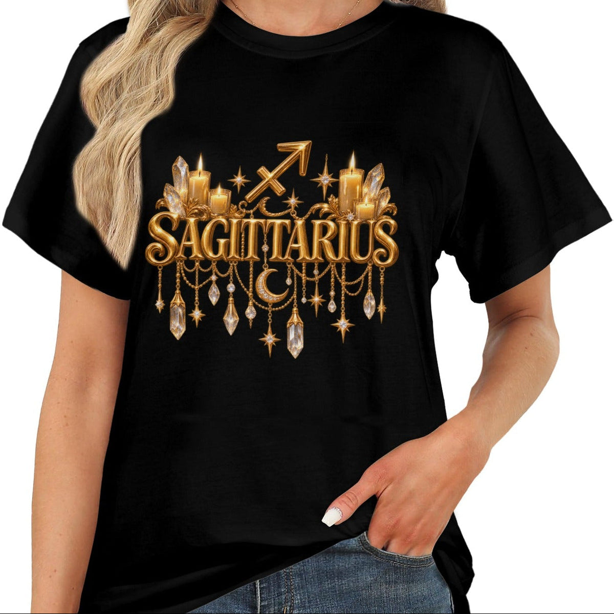 A woman wearing a black short-sleeve t-shirt with a gold Sagittarius zodiac graphic on the chest, paired with blue jeans against a plain white background.