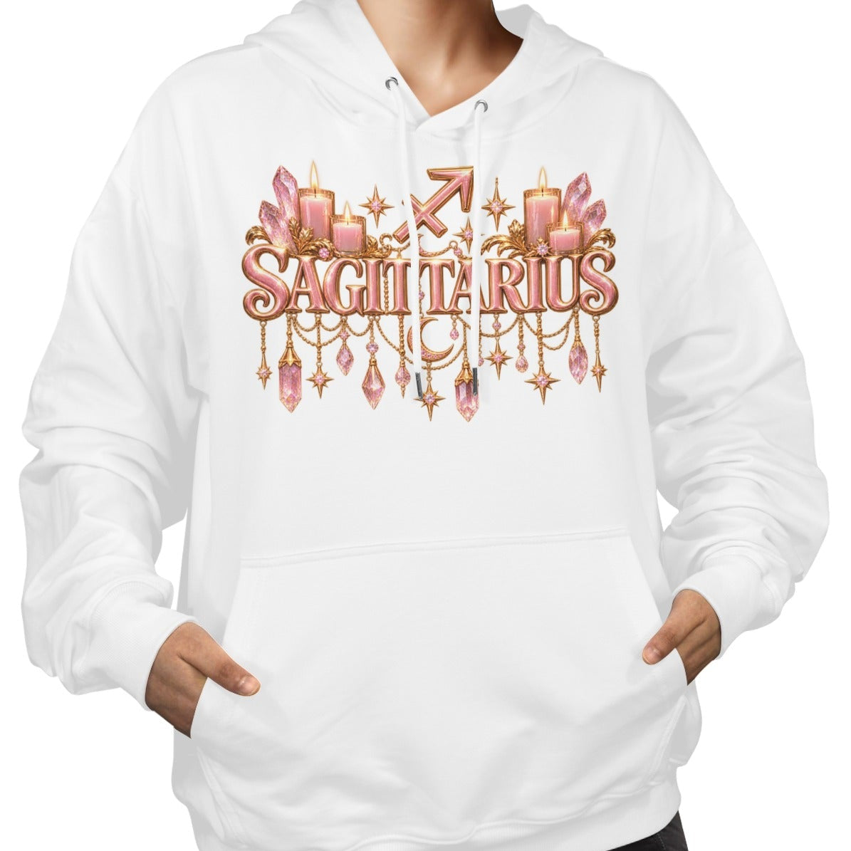 A woman wearing a white pullover hoodie with a 'Sagittarius' zodiac graphic on the chest. The graphic features pink and gold candles, crystals, and stars.