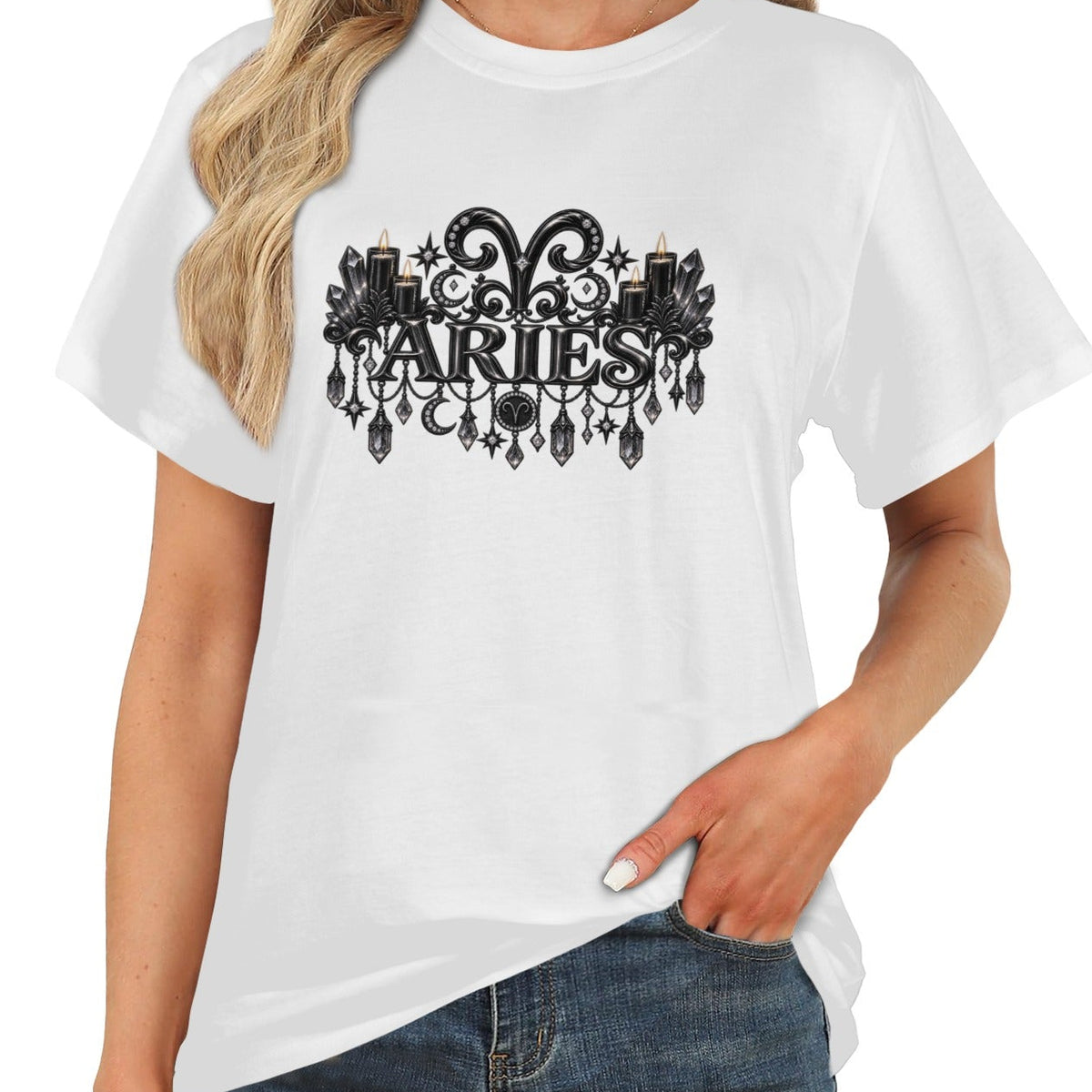 A woman wearing a white short-sleeve t-shirt with a black gothic-style 'Aries' zodiac graphic on the chest, paired with blue jeans against a plain white background.